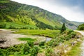 Idyllic view in Glendalough Valley, County Wicklow, Ireland. Mountains, lake and tourists walking paths Royalty Free Stock Photo