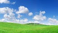 Idyllic view, green hills and blue sky with white clouds Royalty Free Stock Photo