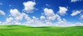 Idyllic view, green hills and blue sky with white clouds Royalty Free Stock Photo