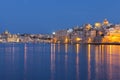 Idyllic view of Malta's Tricity area with lights glowing in the sea