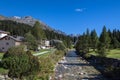 Idyllic view of the small village San Bernardino in Mesolcina valley with Moesa river and Swiss Alps mountain in background, on Royalty Free Stock Photo