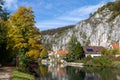 Idyllic view at the village Markt Essing in Bavaria, Germany with the Altmuehl river and high rocks