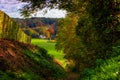 Idyllic view of vineyards in Maastricht changing colours in Autumn with an amazing view over the valley and the forest of the oppo Royalty Free Stock Photo