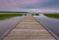 Idyllic view of the wooden pier in the lake with chairs for negotiations Royalty Free Stock Photo