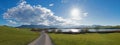 Idyllic walkway around riegsee lake, with view to mountain range upper bavaria