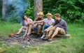 Idyllic weekend. Friends enjoy weekend barbecue in forest. Group friends spend leisure weekend hike picnic forest nature Royalty Free Stock Photo