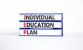 IEP individual education plan symbol. Concept words IEP individual education plan on books on beautiful white table white
