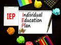 IEP individual education plan symbol. Concept words IEP individual education plan on white note on a beautiful black background.