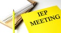 IEP MEETING text written on a yellow paper with notebook Royalty Free Stock Photo