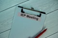 IEP Meeting write on a paperwork isolated on office desk