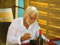 Ierre Richard autographing bottles at his winery