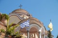 Iew on backyard of Monastery of Archangel Michael in Greece, Thasos Island, with vivid orange walls and roof,