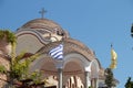 Iew on backyard of Monastery of Archangel Michael in Greece, Thasos Island, with vivid orange walls and roof,