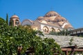 Iew on backyard of Monastery of Archangel Michael in Greece, Thasos Island, with vivid orange walls and roof,