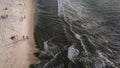 Iew over beach, stunning aerial view of a rocky shore with a beautiful beach bathed by a rough sea during sunset, Balangan Beach Royalty Free Stock Photo