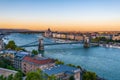 Iew of the Szechenyi Chain Bridge over Danube and the Hungarian Parliament Building in Budapest, Hungary Royalty Free Stock Photo