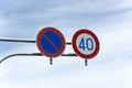 Iew on two round traffic signs above the road to enhance the road safety Royalty Free Stock Photo