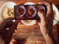 If this doesnt entice your tastebuds, what will. an unrecognisable man using a smartphone to take pictures of a healthy