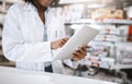 If we dont have it, well get it for you. an unrecognizable young female pharmacist working in a pharmacy. Royalty Free Stock Photo