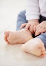 If I could just stand up on these...Cropped closeup shot of a toddlers tiny feet.