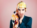 If looks could kill. Studio portrait of a confident young woman wearing a colorful head scarf while posing against a Royalty Free Stock Photo