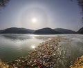 Spring flood and shore with garbage