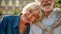 If it is real, it will never be over. Happy senior couple bonding to each other and smiling while sitting on the park Royalty Free Stock Photo