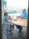 If you cant beat them, bluff them. A group of seniors playing cards together. Royalty Free Stock Photo