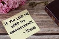 If you love Me keep My commandments, Jesus Christ, handwritten quote with ancient key, holy bible book and flowers Royalty Free Stock Photo
