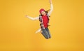 If you want to be happy, be. Happy child jump yellow background. Energetic girl move to music. Headphones technology