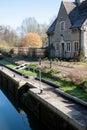 House overlooking Iffley Lock in the picturesque village of Iffley on the River Thames in Oxfordshire, UK Royalty Free Stock Photo