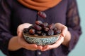 Iftar delight Modern Muslim woman holds plate of sweet dates