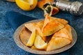 Iftar food during ramadan, arabic and middle eastern food concept. Fatayer sabanekh - traditional arabic spinach triangle hand pi Royalty Free Stock Photo