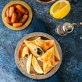 Iftar food during ramadan, arabic and middle eastern food concept. Fatayer sabanekh - traditional arabic spinach triangle hand pi Royalty Free Stock Photo