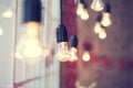 Iful festoon light bulb hanging at the window Royalty Free Stock Photo