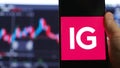 IG Trading app smartphone equities rates trader broker work in stock exchange market