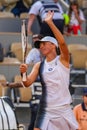 Iga Swiatek of Poland celebrates victory after women first round match against Cristina Bucsa of Spain at 2023 Roland Garros