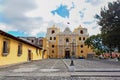 Iglesia De La Merced and cobblestone paved plaza with cross, Antigua, Guatemala Royalty Free Stock Photo