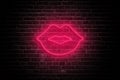 Neon Kiss: Valentine\'s Day Lips on Dark Brick Wall Royalty Free Stock Photo