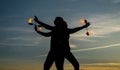 Ignite your dancing flame. Dancing couple spin burning poi. Flame dancers on idyllic sky. Evening shades and lights Royalty Free Stock Photo