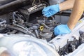 Ignition coil and car spark plug change or replacement. Repairing of vehicle engine Royalty Free Stock Photo