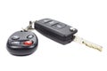 Ignition key and garage door remote control on a white background