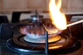 Ignition of a gas ring on the stove Royalty Free Stock Photo