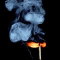 Ignition of match with smoke, isolated on black background Royalty Free Stock Photo