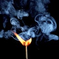 Ignition of match with smoke, isolated on black background Royalty Free Stock Photo