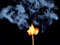 Ignition of match with smoke, isolated on black background Royalty Free Stock Photo