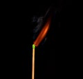 Ignition of match with smoke, isolated on black background Royalty Free Stock Photo