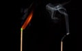 Ignition of match with smoke, isolated on black background Royalty Free Stock Photo