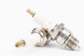 Ignition spark plug with platinum electrode. Automotive parts isolated above white background