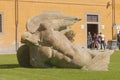 The Igor Mitoraj`s sculpture Fallen angel Angelo caduto in Piazza dei Miracoli field Royalty Free Stock Photo
